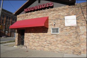 Three men and three women were injured in a shooting outside Mugshots bar in North Toledo early Monday.