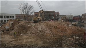 Demolition of the Seneca County courthouse can be seen through a second floor window of the Seneca County Common Pleas Court in Tiffin, Ohio.