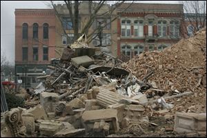 A pile of rubble lay were the 1884 Seneca County courthouse once stood in Tiffin, Ohio.