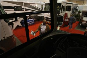Visitors check out the recreational vehicles on display at the Camp & Travel Family RV Show.