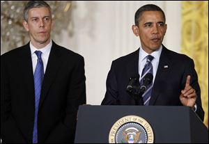 President Barack Obama, accompanied by Education Secretary Arne Duncan speaks about No Child Left Behind in the East Room of  the White House in Washington.