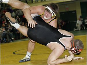 Clay's Garrett Gray takes down Liberty Center's Justin Gillen in the 285-pound final at the Maumee Bay Classic. Gray has a 33-5 record this season.