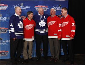 National Hockey League alumni, from left, Red Kelly, Ted Lindsay, George Armstrong, Alex Delvecchio, and Kris Draper pose during the announcement of the NHL Winter Classic hockey game at Comerica Park  in Detroit.