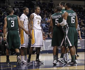 The Rockets' Rian Pearson (5) stands his ground as tensions rose during Wednesday's UT-Ohio game at Savage Arena.