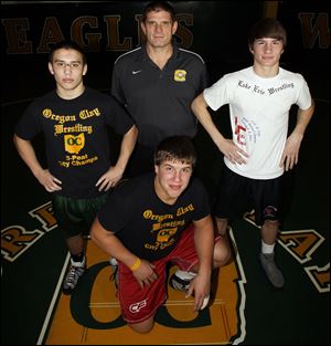 Clay coach Ralph Cubberly has three wrestlers who reached the state tournament last year — Angelo Amenta, left, Garrett Gray and Mike Screptock.