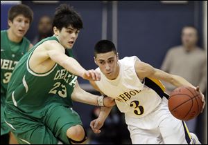 Delta's Tyson Schnitkey (23) defends against  Archbold's Gabe Rodriguez (3).