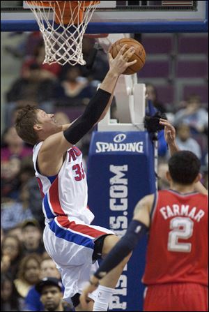 Detroit’s Jonas Jerebko takes a shot under the basket. Jerebko had a team-high 20 points for the Pistons.