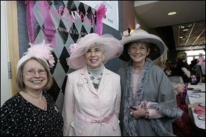 Rita Krebs, Rebecca Ott and Pat Lewandowski wear hats to celebrate the Pretty in Pink fashion show and honor cancer survivors.