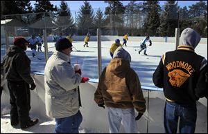 Spectators brave the cold to cheer on their favorites in a game between the Detroit MORC Stars and the Michigan FAR Flyers. The inaugural UCT Winter Hockey Festival kicked off Saturday. 