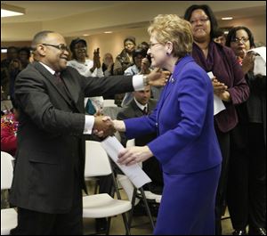 U.S. Rep. Marcy Kaptur is thanked by Pastor Clayton E. Howard after speaking at the groundbreaking for an addition to Ebenezer Baptist Church in Sandusky. 
