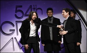 Dave Grohl and the Foo Fighters accept the award for best music video long form at the 54th annual GRAMMY Awards pre-show on Sunday.