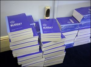 Copies of President Obama's fiscal 2013 federal budget arrive at the House Budget Committee on Capitol Hill. 