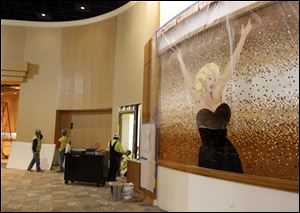 A likeness of Marilyn Monroe fills much of a wall in the Hollywood Casino Toledo under construction along the Maumee riverfront adjacent to the city of Rossford. The casino may open in late May but not on Memorial Day, regulators ruled Wednesday.