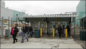 Employees at GM Toledo Transmission leave the plant. Union officials said General Motors' return to profitability vindicates the U.S. government's decision three years ago to fund the automaker's $49.5 billion bailout.