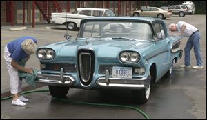 John and Darlene Scott, of Knoxville, Iowa, polish their 1958 Edsel, Wednesday, July 25, 2001, during the International Edsel Club's annual rally in Chattanooga, Tenn. 