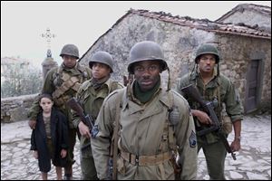 Matteo Sciabordi, Omar Benson Miller, Michael Ealy, Derek Luke and Laz Alonso are shown in a scene from 