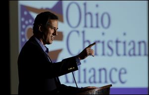 Republican presidential candidate, former Pennsylvania Sen. Rick Santorum addresses the Ohio Christian Alliance conference Saturday, in Columbus, Ohio.
