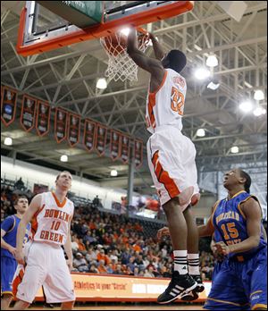 Bowling Green State University forward Torian Oglesby (32) dunks the ball against  Morehead State Saturday, at the Stroh Center in Bowling Green, Ohio.