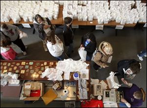Customers line up to pay for their bags of paczki. Paczki traditionally were made by the Polish as they used up their butter and eggs before the 40-day Lenten fast. It begins Wednesday.