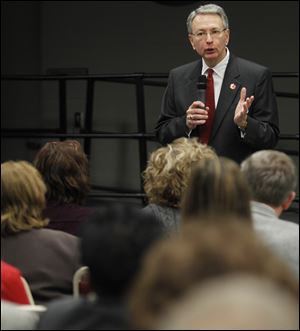 Randall R. Miller, a senior consultant to the chancellor of Wayne County Community College District in Detroit, makes a point.