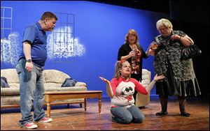Kevin Harrington, left, MaryAnn Mead, Dawn Yark, and Jeff Smith rehearse a scene from Oregon Community Theatre's presentation of 'Sylvia' at Fassett Auditorium in Oregon. 