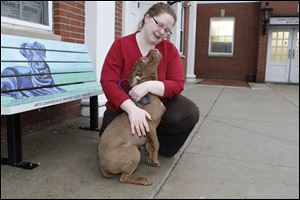 Ohio Gov. John Kasich signed the new law on dogs Tuesday. It will take effect on May 20.  Lucas County Dog Warden July Lyle, right, with a pit bull.
