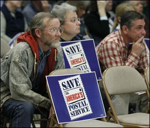 Richard Brust, Toledo postal worker, listens during The U.S. Postal Service's public meeting in December to explain why it wants to move mail processing out of the downtown Toledo facility. 
