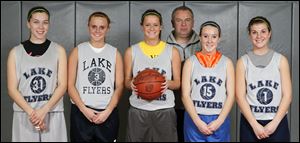 Lake coach Denny Meyer stands with his starters, from left, Alyssa Shaffer, Hannah Cox, Hunter Johnson, Catie Phalen, and Jordyn Taylor. The Flyers won the Northern Buckeye Conference championship. They had won the final three Suburban Lakes League titles.