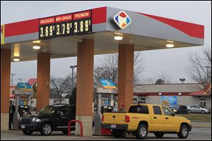 Motorists refuel at the Kroger station at the corner of Glendale and Byrne in South Toledo. Gas prices have risen steadily since December, a month where consumers usually have a respite from price increases.
