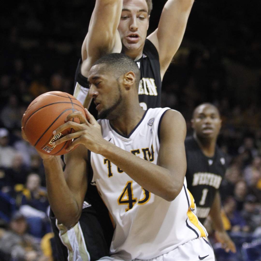 University-of-Toledo-player-Matt-Smith-43-tries-to-get-around-Western-Michigan-player-Dan-Loney-42