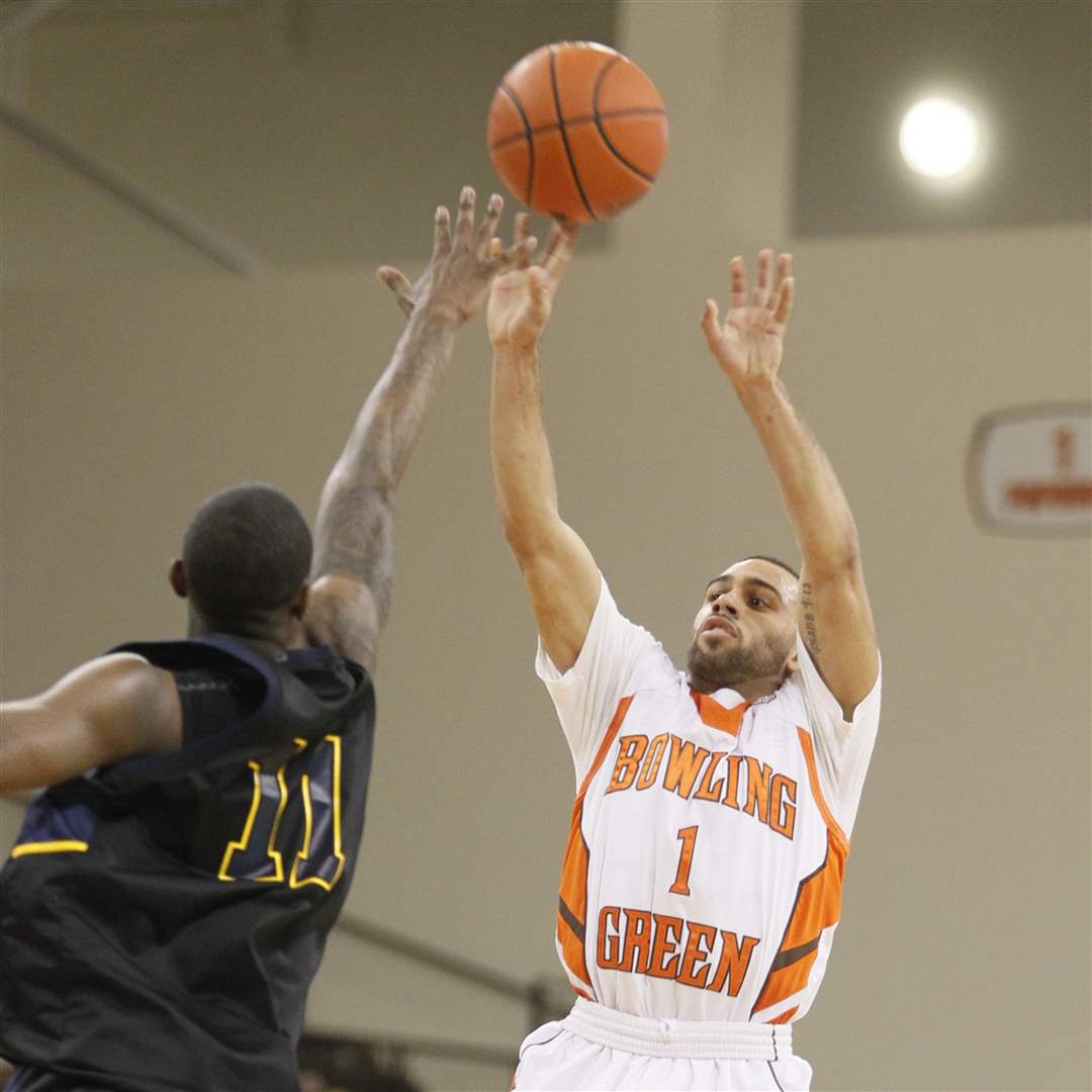 BGSUs-Jordon-Crawford-shots-a-3-pointer-over-Kents-Carlton-Guyton