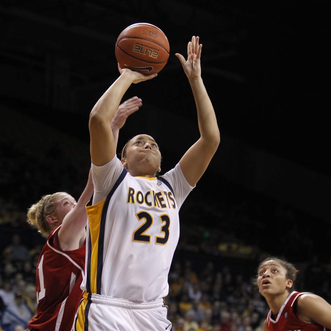 UT-s-Inma-Zanoguera-shoots-outside-the-reach-of-NIU-s-Courtney-Shelton