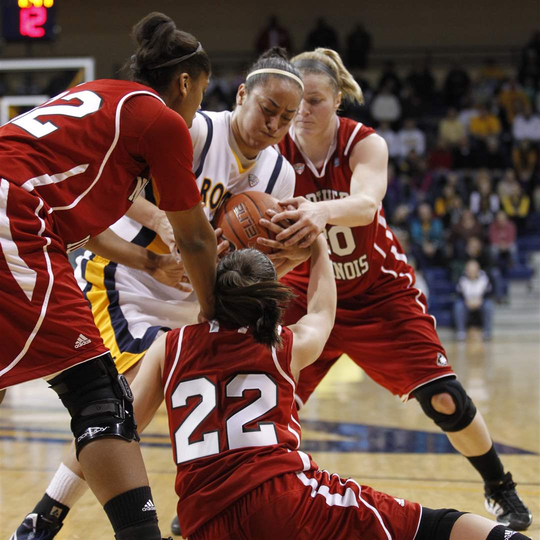 UT-s-player-Inma-Zanoguera-fights-for-a-rebound-with-a-host-of-Huskies-players
