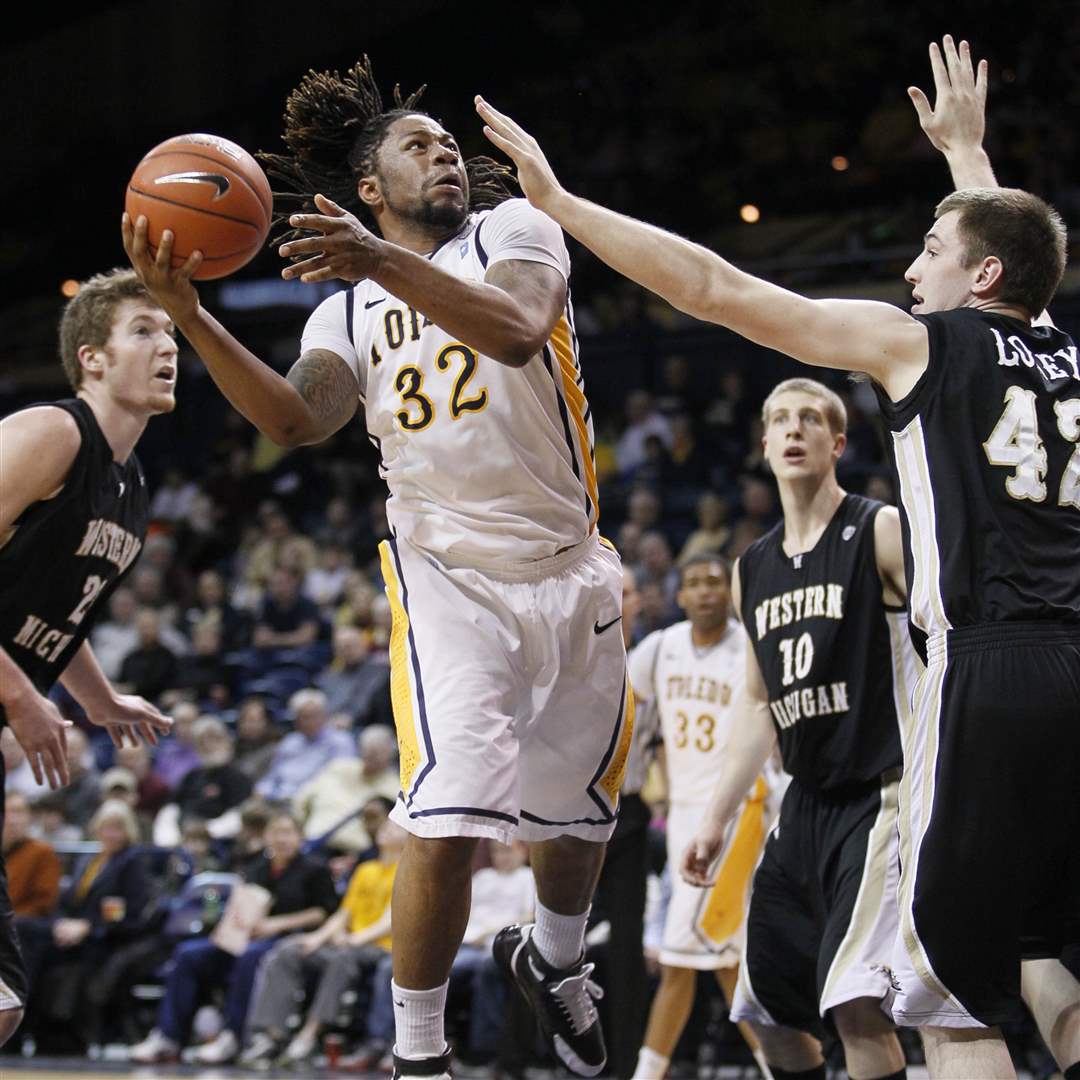 University-of-Toledo-player-Reese-Holliday-32-shoots-over-Western-Michigan-player-Dan-Loney-42