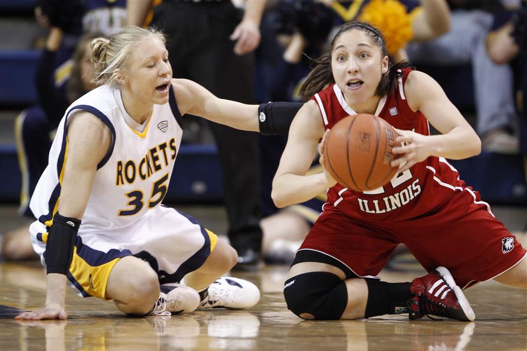UT-s-Haylie-Linn-scrambles-for-a-loose-ball-which-NIU-s-Amanda-Corral-scooped-up
