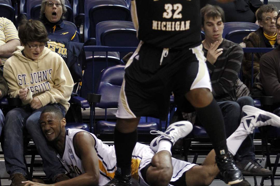 University-of-Toledo-player-Matt-Smith-43-runs-into-a-fan-during-the-first-half