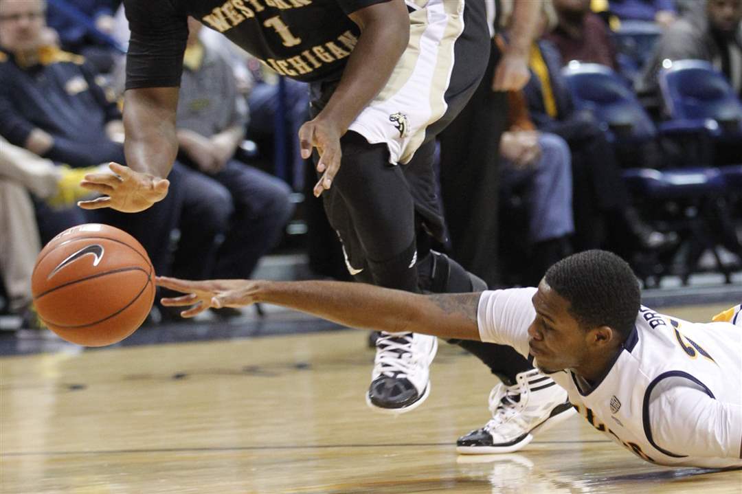 University-of-Toledo-player-Julius-Brown-tries-to-steal-the-ball-from-Western-Michigan-player-Demetrius-War