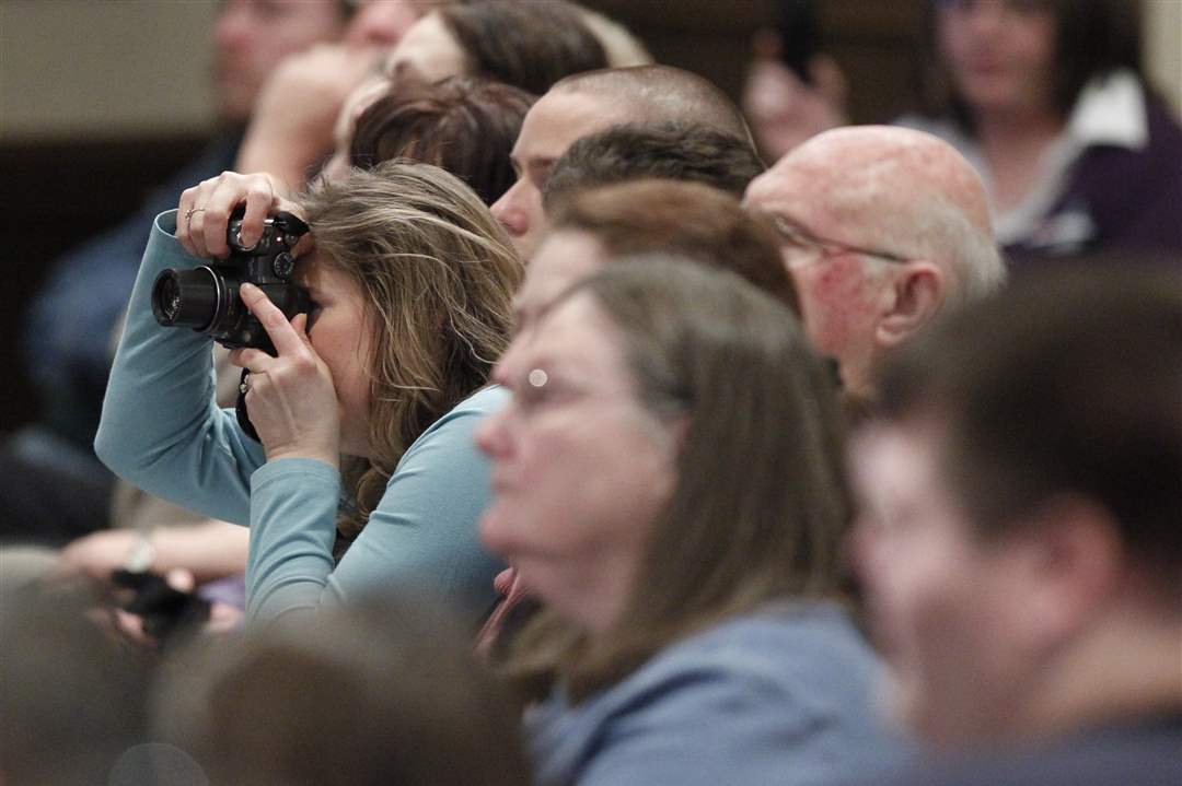 An-audience-member-takes-a-photo-of-Republican-presidential-candidate-Rick-Santorum