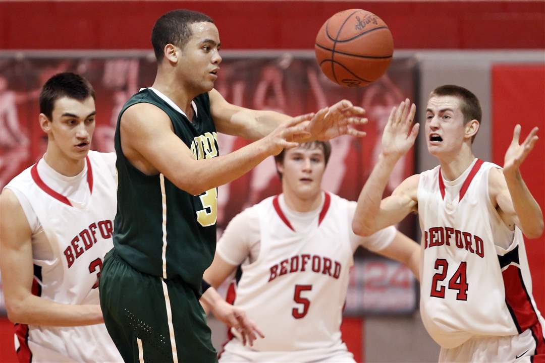 Ann-Arbor-Huron-s-Mike-Lewis-33-passes-the-ball