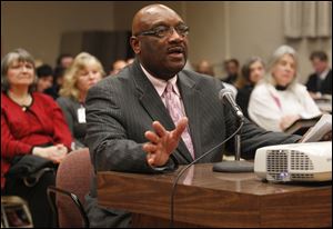 Sylvester Gould, an officer of the Economic Opportunity Planning Association, which operates Head Start in Toledo, reminds the board that the central Toledo community has long supported levies.