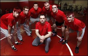 Bedford, under coach Kevin Vogel, had six wrestlers qualify to the Division 1 state tournament at the Palace of Auburn Hills -- from left, Mitch Rogaliner, Al Regnier, Bryan Smith, Logan Rimmer, Brandon Sunday, and Mitch Pawlak. The Mules won the Southeastern Conference championship.