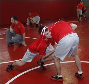 Mitch Pawlak, left, and Mitch Rogaliner practice against each other. Pawlak is ranked No. 5 at 119 pounds. Rogaliner, is ranked No. 1 at 112 and looking for his second state title.
