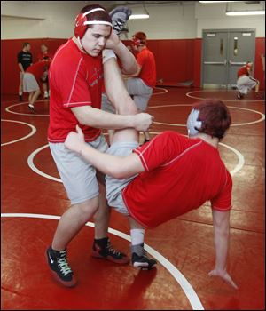 Bryan Smith (215 pounds) takes down Codie Bettencourt during practice. Smith finished in fifth place last year at state. 