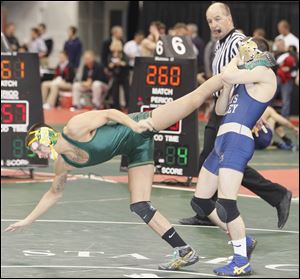 Jacob Conine of Oregon Clay breaks free en route to defeating Cole Nace of Ashville Teays Valley.