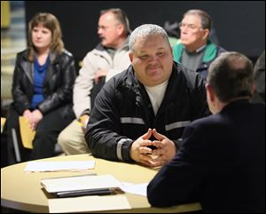 Mark Bucher of Oregon, Ohio, interviews at a job fair earlier this year at Raceway Park in Toledo.