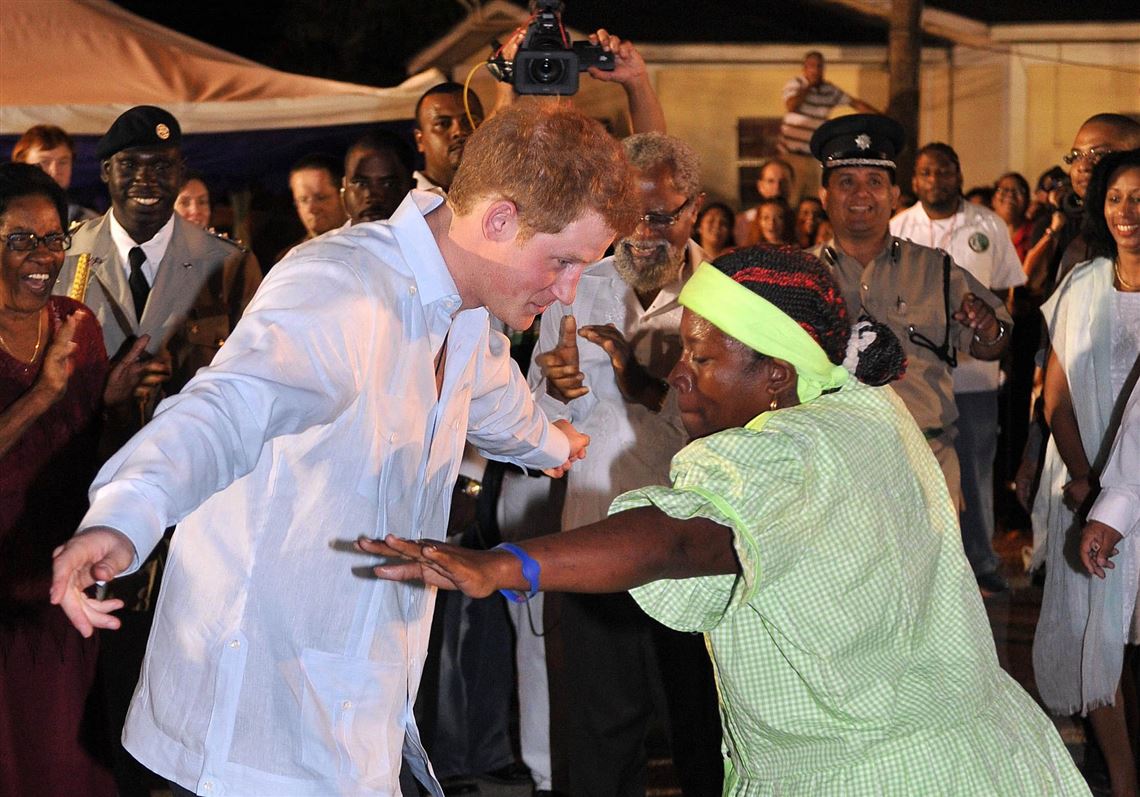 Prince Harry boogies, samples local rum to delight of Belize crowds on Diamond Jubilee visit!