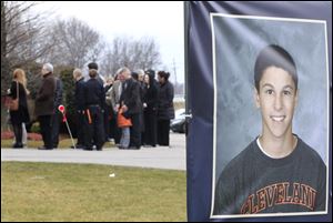 Mourners line up outside Monreal Funeral Home in Eastlake, Ohio, to pay respects to Daniel Parmertor, 16.