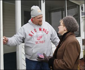 Point Place resident Scott Billock, left, and U.S. Rep. Marcy Kaptur.  U.S. Rep. Marcy Kaptur campaigns in the Point Place section of Toledo as she goes door-to-door for the newly created 9th Congressional District in Toledo, Ohio on Saturday.