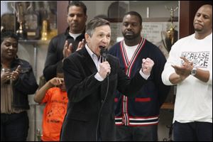 U.S. Rep. Dennis Kucinich speaks at a rally at Scott High School. He vowed to take action to prevent the transfer of Toledo’s Head Start program to a new operator.
