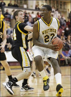 Whitmer's Nigel Hayes drives against Northview's Conner Hartnett. Whitmer is now 19-2.